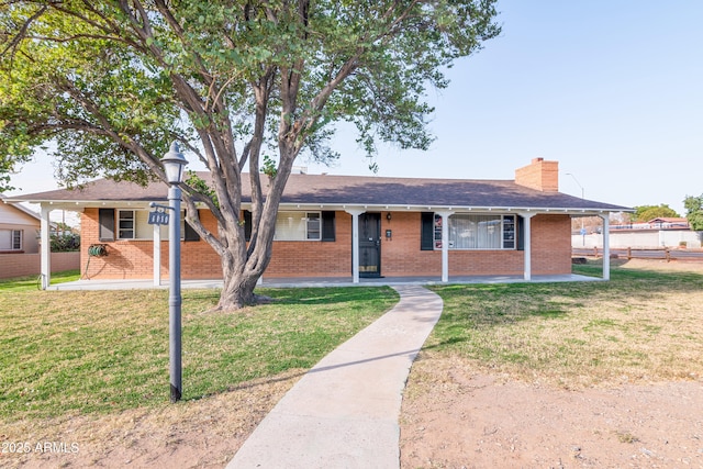 ranch-style house featuring a front lawn