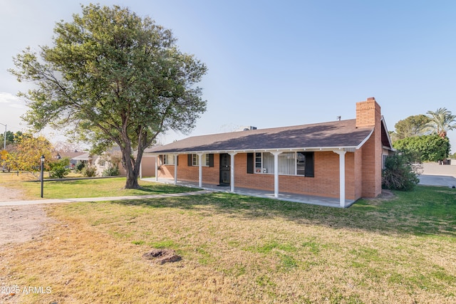 ranch-style home with a front yard