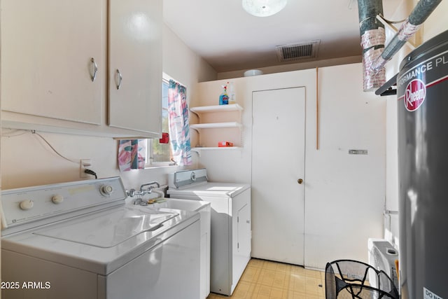 laundry area with cabinets and washer and dryer