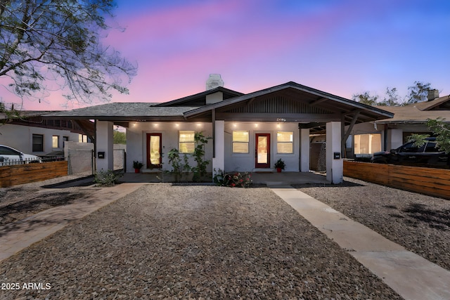 1306 E Fillmore St, Phoenix, AZ 85006 - view of front facade featuring covered porch, a chimney, and stucco siding
