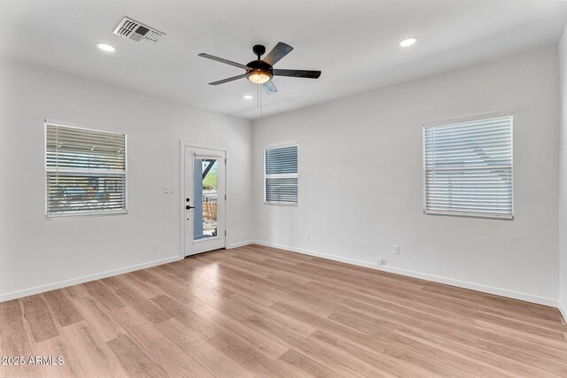 1306 E Fillmore St, Phoenix, AZ 85006 - spare room featuring ceiling fan, light wood-style floors, baseboards, and recessed lighting