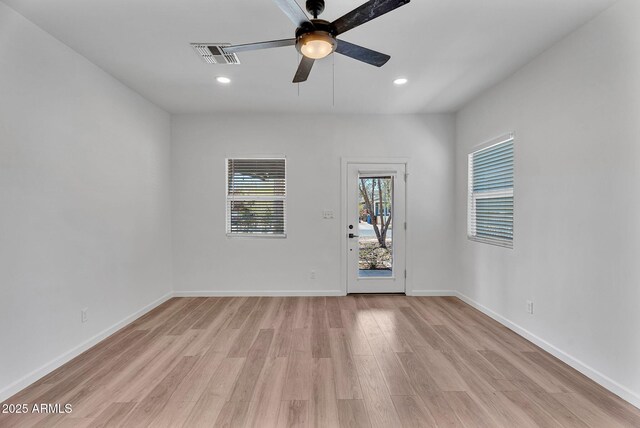1306 E Fillmore St, Phoenix, AZ 85006 - unfurnished room featuring light wood-style flooring, ceiling fan, recessed lighting, and baseboards