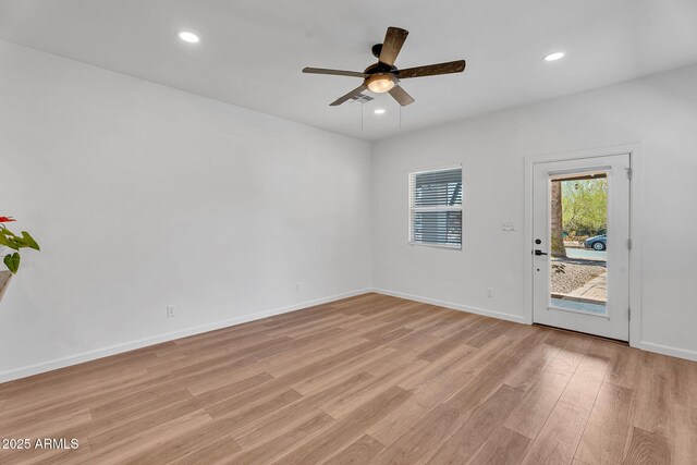 1306 E Fillmore St, Phoenix, AZ 85006 - spare room with light wood finished floors, ceiling fan, recessed lighting, and baseboards