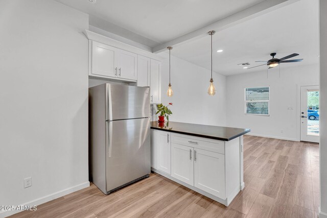 1306 E Fillmore St, Phoenix, AZ 85006 - kitchen featuring freestanding refrigerator, a peninsula, light wood finished floors, dark countertops, and recessed lighting