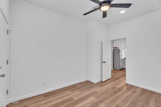 1306 E Fillmore St, Phoenix, AZ 85006 - spare room featuring a ceiling fan, light wood-style floors, baseboards, and recessed lighting