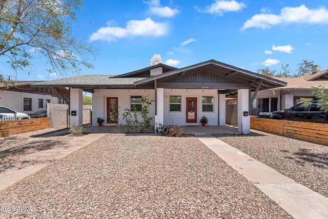 1306 E Fillmore St, Phoenix, AZ 85006 - view of front of property with covered porch, stucco siding, a chimney, and a gate
