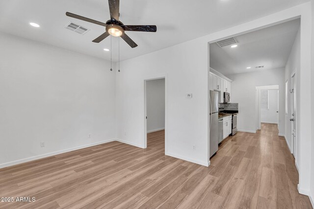 1306 E Fillmore St, Phoenix, AZ 85006 - unfurnished living room with light wood finished floors, ceiling fan, recessed lighting, and baseboards