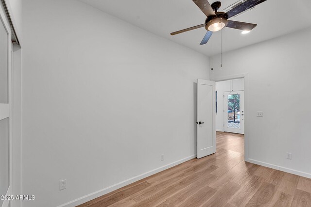 1306 E Fillmore St, Phoenix, AZ 85006 - empty room featuring a ceiling fan, light wood finished floors, and baseboards