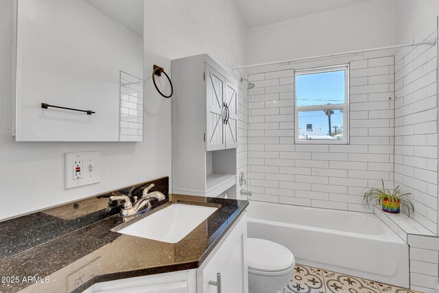 1306 E Fillmore St, Phoenix, AZ 85006 - bathroom with vanity, toilet, bathing tub / shower combination, and tile patterned floors