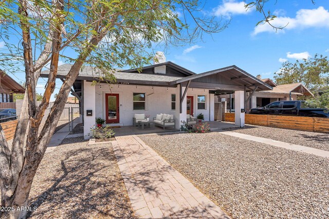 1306 E Fillmore St, Phoenix, AZ 85006 - view of front of house with an outdoor living space, stucco siding, and a patio area
