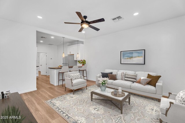 1306 E Fillmore St, Phoenix, AZ 85006 - living area with a ceiling fan, light wood finished floors, recessed lighting, and baseboards