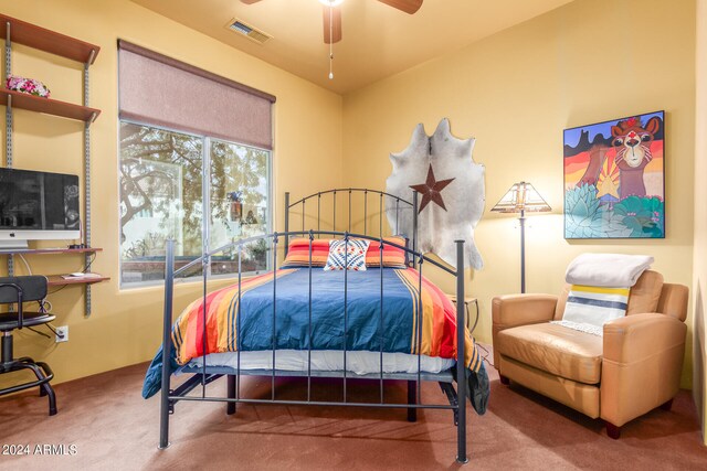 carpeted bedroom featuring visible vents