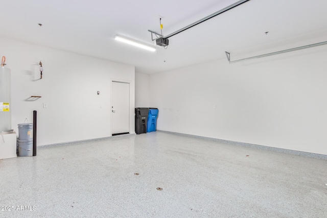 garage featuring baseboards and a garage door opener