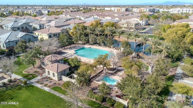 birds eye view of property with a residential view