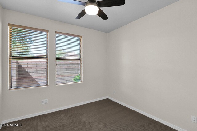 unfurnished room with carpet and ceiling fan