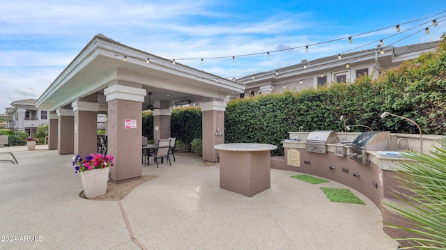 view of patio / terrace with grilling area, an outdoor kitchen, and a gazebo