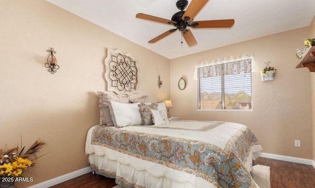 bedroom with ceiling fan and dark wood-type flooring