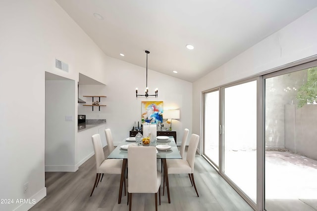 dining space featuring vaulted ceiling, recessed lighting, light wood finished floors, visible vents, and a notable chandelier