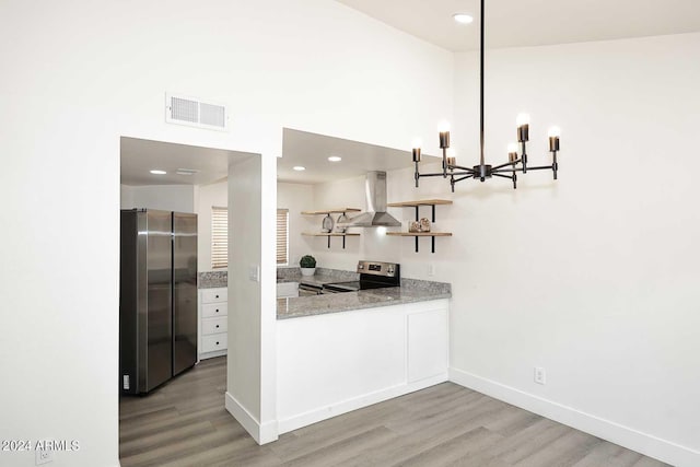 kitchen featuring open shelves, stainless steel appliances, visible vents, a notable chandelier, and wall chimney exhaust hood
