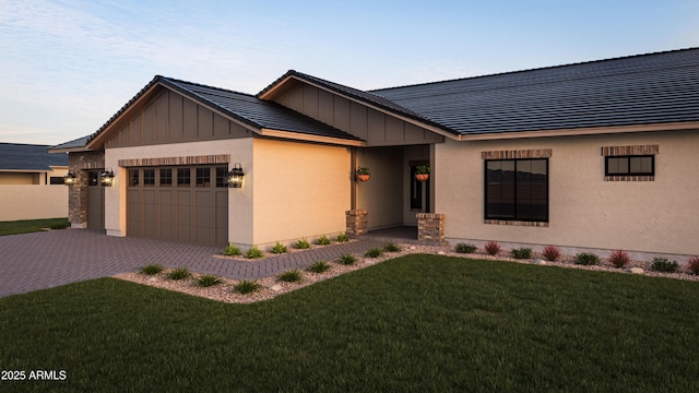 11263 E Crescent Ave, Mesa, AZ 85208 - view of front of property featuring board and batten siding, an attached garage, a front yard, and decorative driveway
