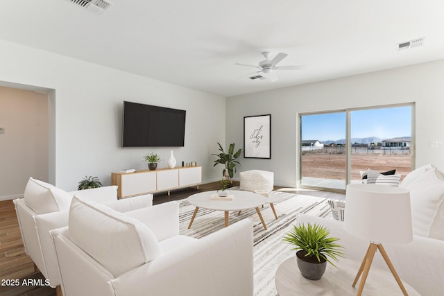 11263 E Crescent Ave, Mesa, AZ 85208 - living room featuring wood finished floors, a ceiling fan, and baseboards