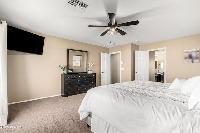 bedroom with ceiling fan, ensuite bath, and carpet floors