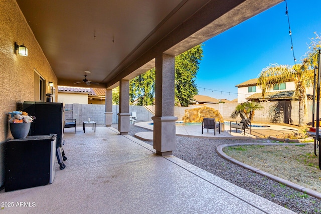 view of patio featuring ceiling fan