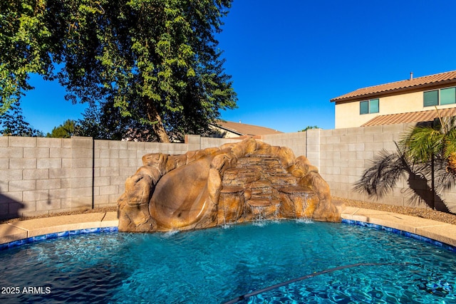 view of pool featuring pool water feature