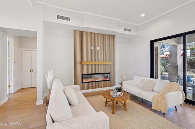 living room with light hardwood / wood-style flooring