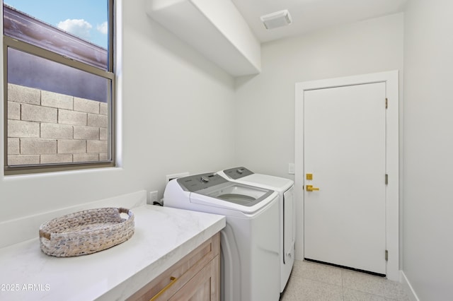 clothes washing area featuring washing machine and clothes dryer