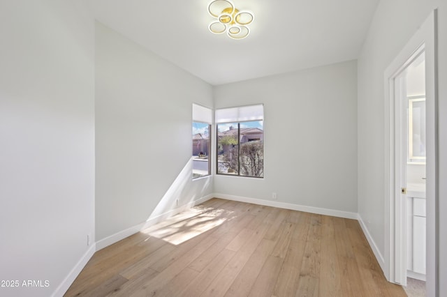 spare room featuring light hardwood / wood-style flooring