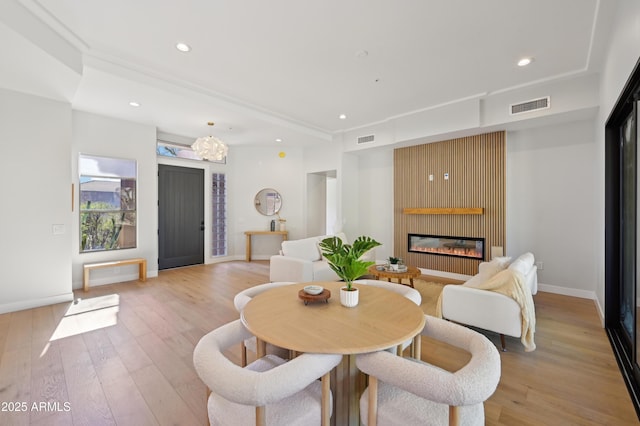 dining space with light hardwood / wood-style flooring