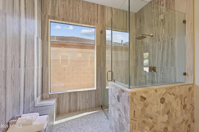 bathroom with a tile shower