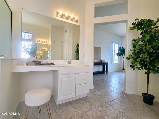 bathroom featuring vanity and baseboards