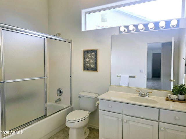 bathroom featuring tile patterned floors, toilet, visible vents, vanity, and enclosed tub / shower combo