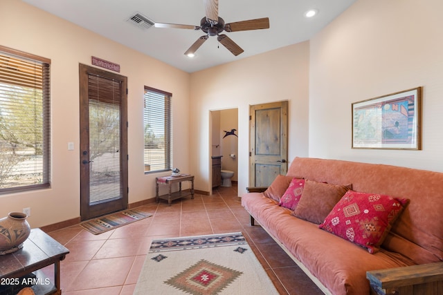 tiled living area featuring ceiling fan, visible vents, baseboards, and recessed lighting