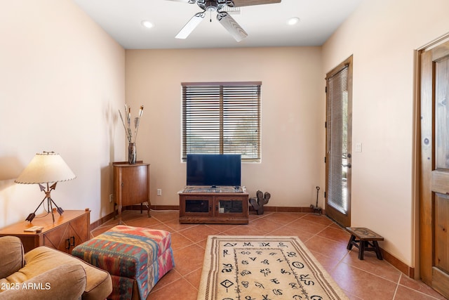 tiled living area with ceiling fan, recessed lighting, and baseboards