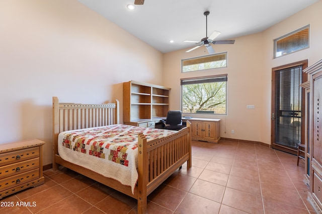 tiled bedroom with ceiling fan, a high ceiling, baseboards, and recessed lighting