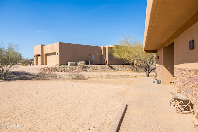 exterior space featuring central AC unit