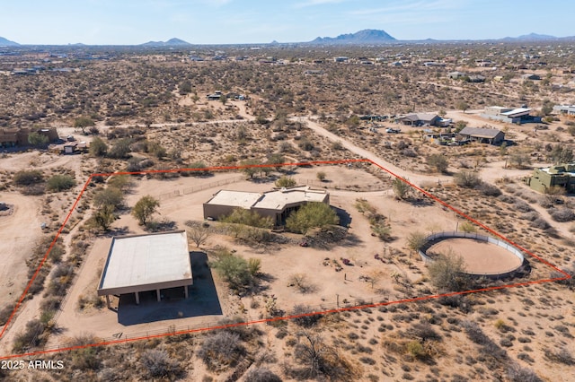 aerial view featuring a rural view, a mountain view, and view of desert