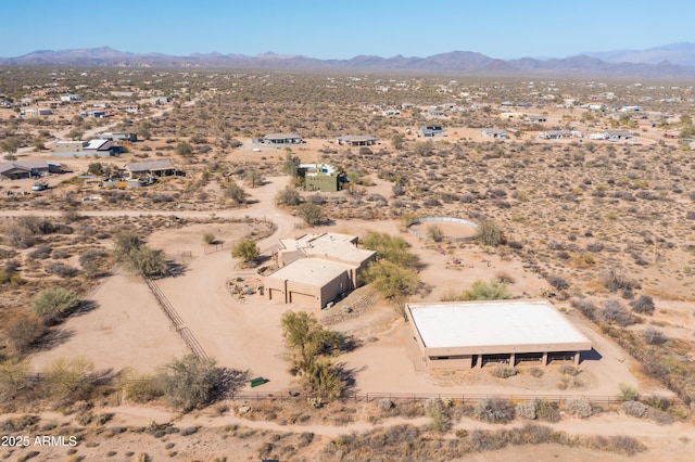 birds eye view of property with a desert view, a rural view, and a mountain view