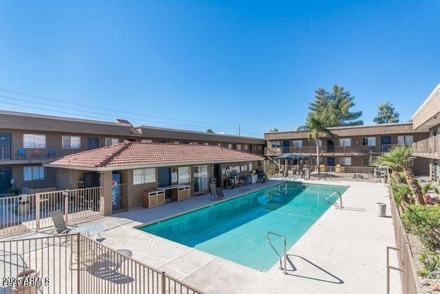 view of swimming pool featuring a patio