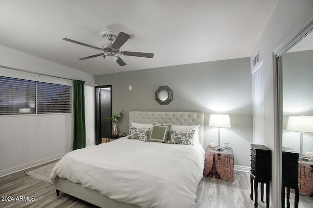 bedroom featuring ceiling fan and hardwood / wood-style flooring