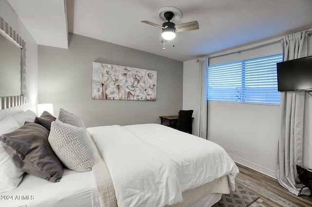 bedroom featuring wood-type flooring and ceiling fan