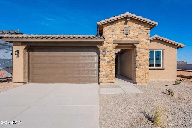 39980 W Bunker Dr, Maricopa, AZ 85138 - view of front of home with a tiled roof, concrete driveway, a garage, and stucco siding