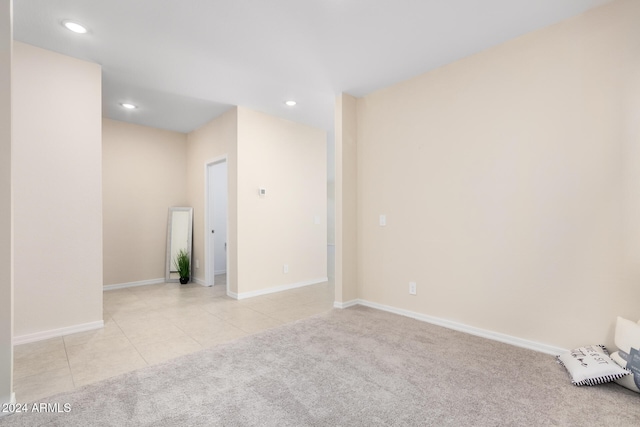 empty room featuring light colored carpet