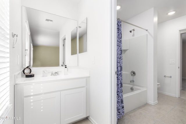 full bathroom featuring tile patterned flooring, vanity, shower / bath combination with curtain, and toilet