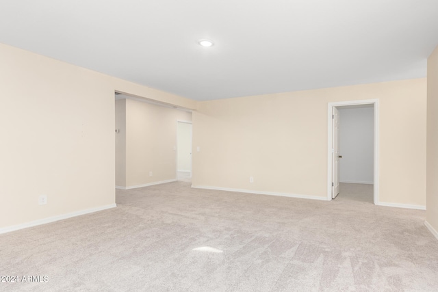 unfurnished room with light carpet