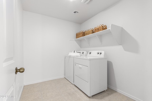 laundry area with independent washer and dryer