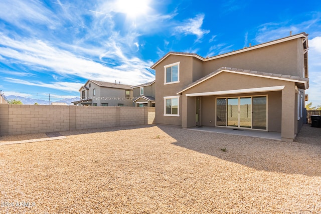 rear view of property with a patio